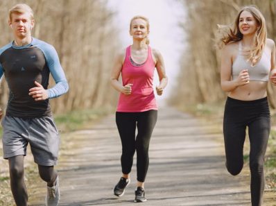 Three adults jogging on a park path, embracing a healthy and active lifestyle.